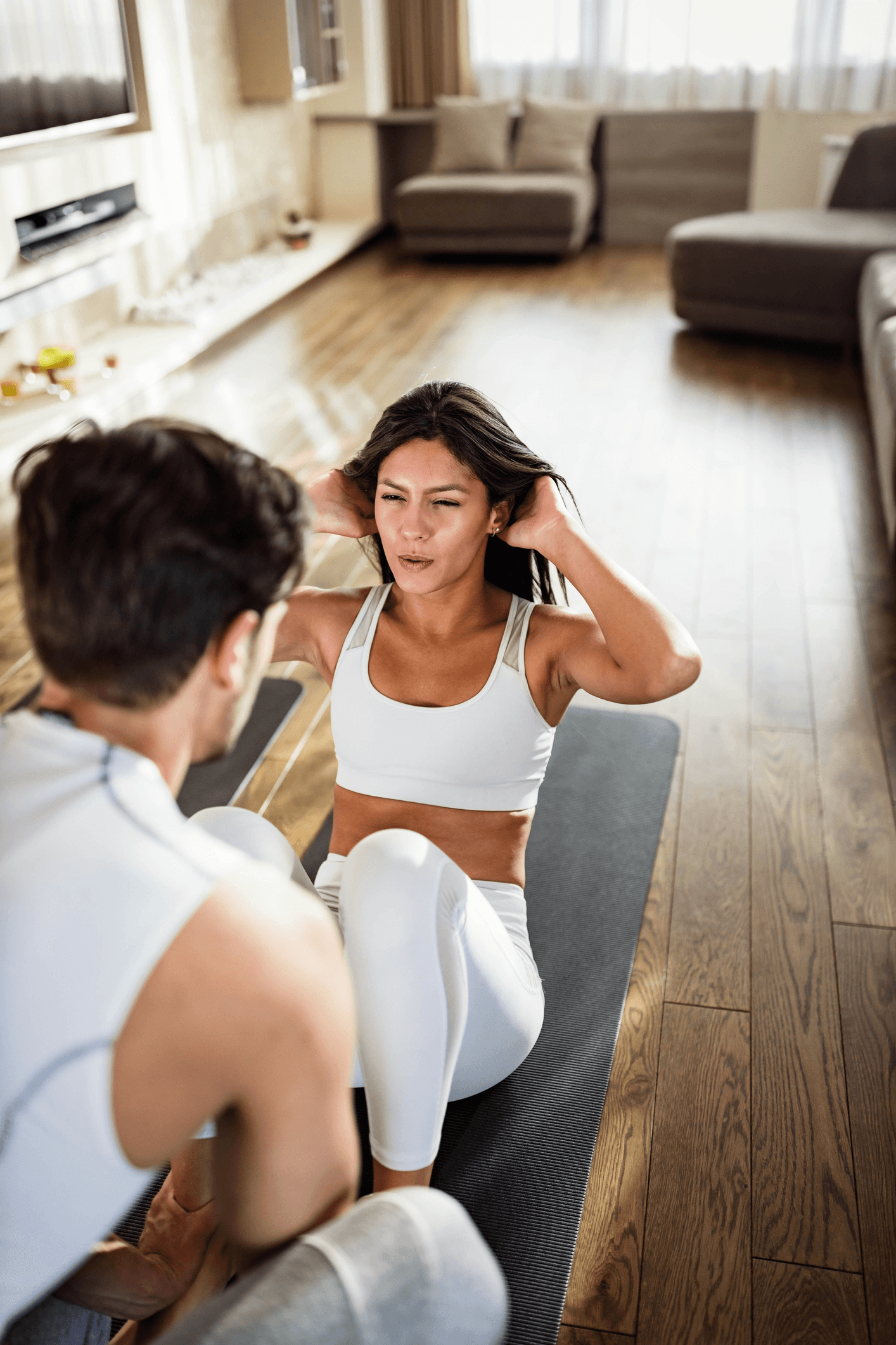 Personal trainer helping a trainee