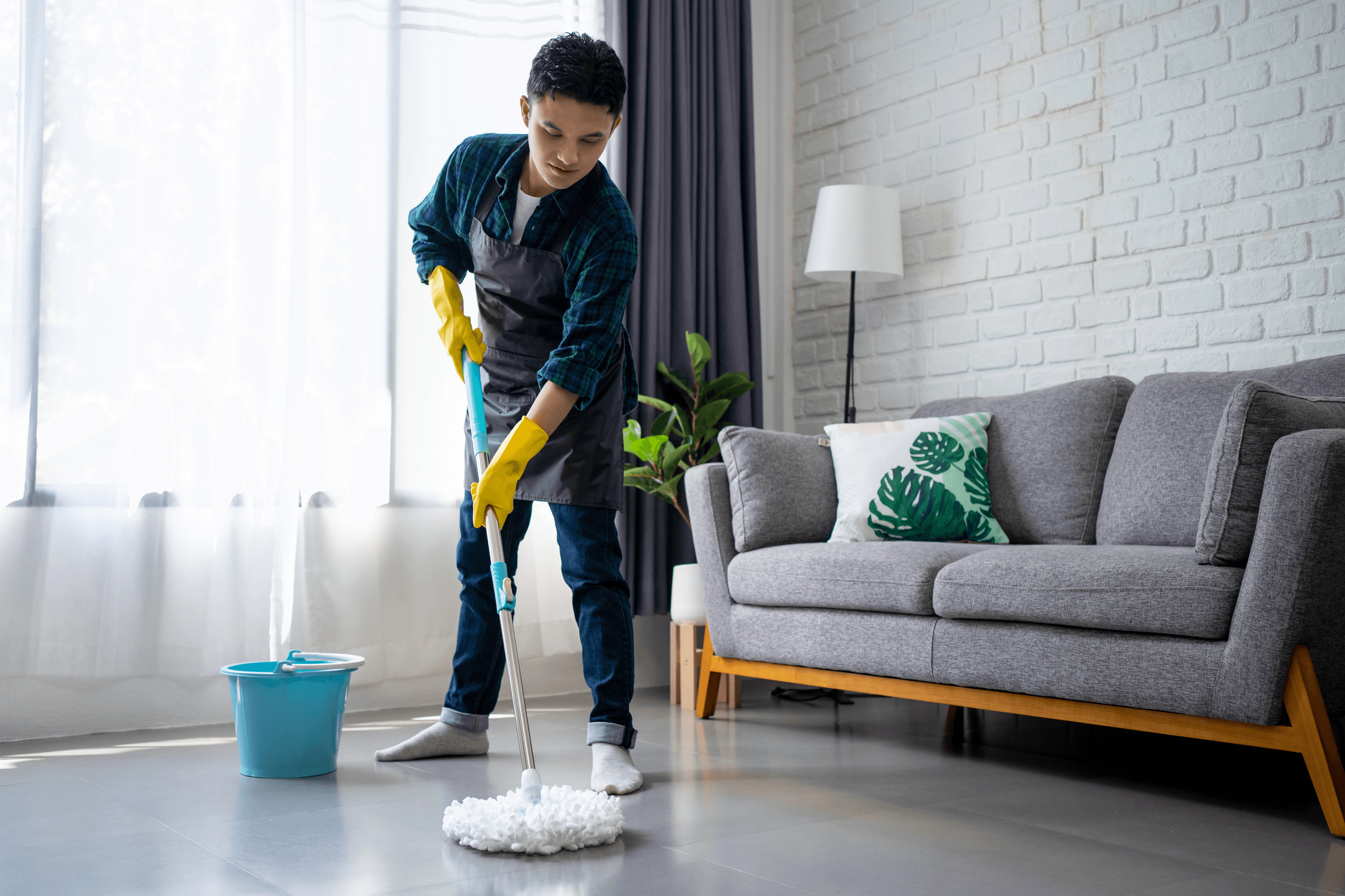 Cleaner mopping down a floor